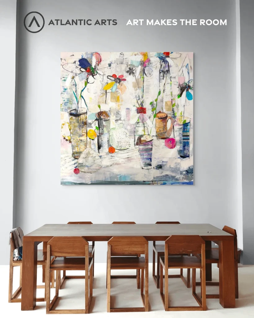 Colorful abstract painting above a dining table, with the words "Art makes the room"